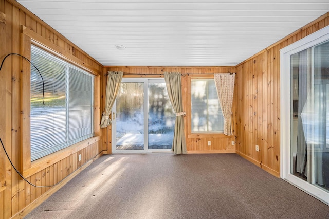 unfurnished sunroom with plenty of natural light