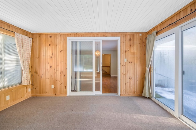 spare room with carpet flooring and crown molding