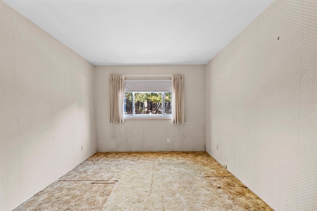 empty room featuring light carpet