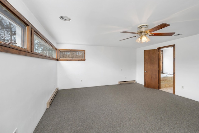 unfurnished room with carpet, ceiling fan, and a baseboard heating unit