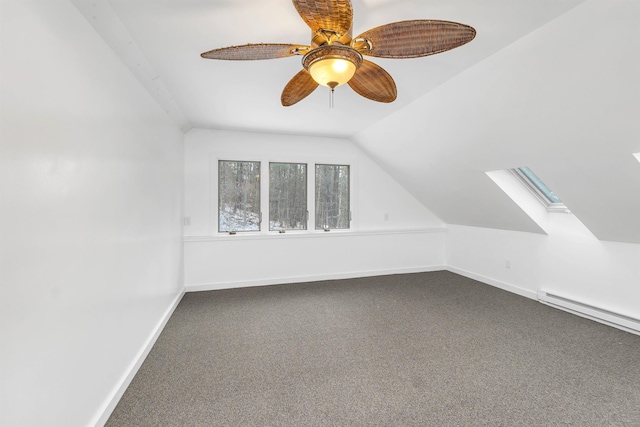 bonus room with ceiling fan, carpet, a baseboard radiator, and vaulted ceiling