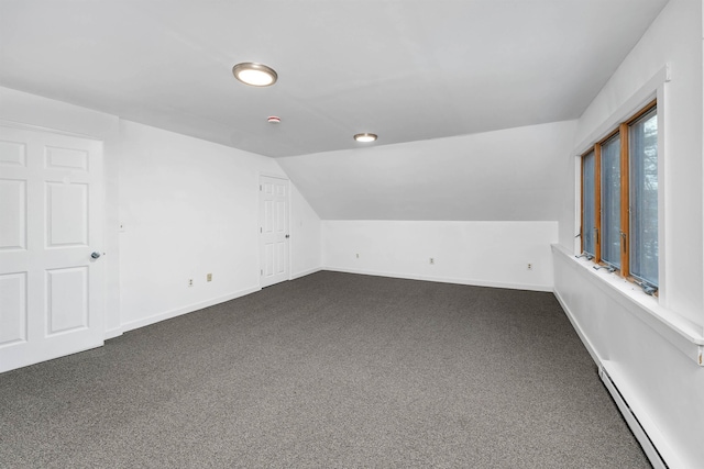 bonus room featuring carpet, a baseboard radiator, and lofted ceiling