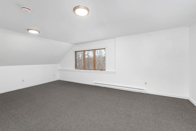 bonus room with baseboard heating, carpet, and lofted ceiling