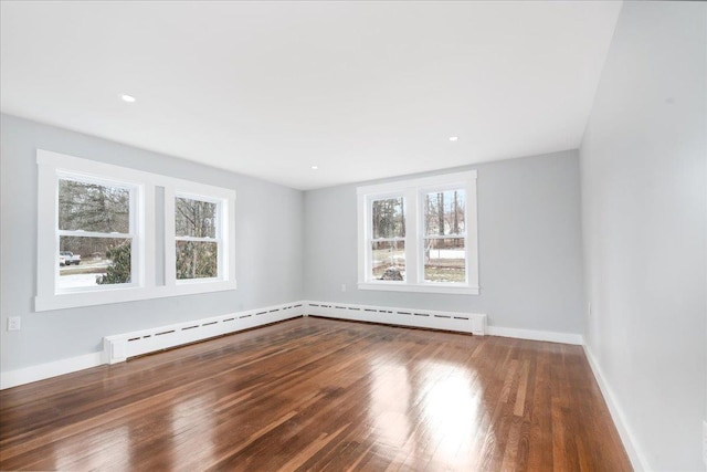 spare room featuring hardwood / wood-style flooring