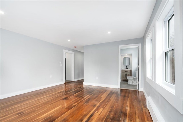 empty room with dark hardwood / wood-style floors