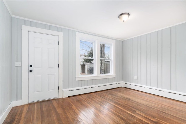 entryway featuring dark hardwood / wood-style flooring and ornamental molding