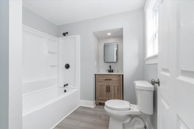 full bathroom featuring shower / bathing tub combination, vanity, toilet, and wood-type flooring