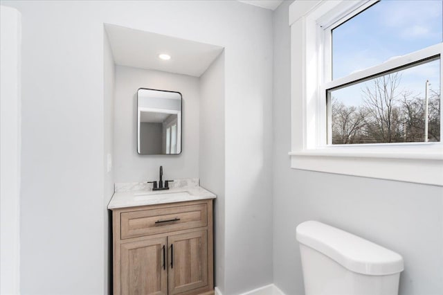 bathroom with vanity and toilet