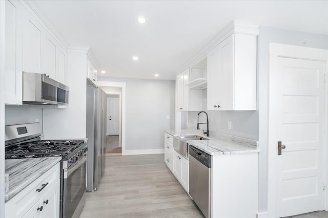 kitchen with white cabinetry and stainless steel appliances