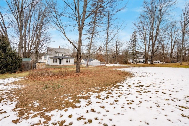 view of yard covered in snow