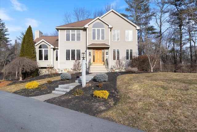 view of front of home with a front lawn