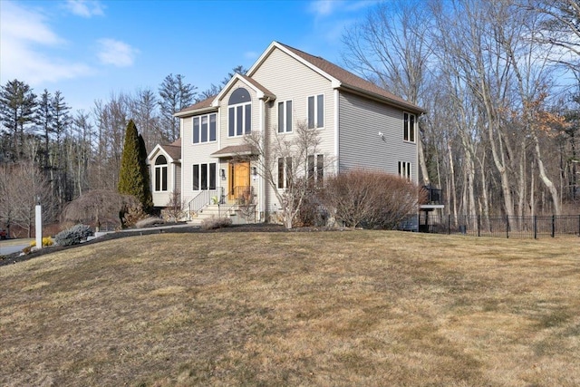 view of front of home with a front lawn