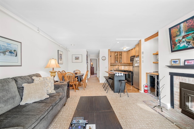 living room with a fireplace and beverage cooler