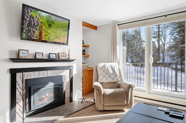 sitting room with a brick fireplace