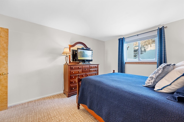 bedroom featuring light colored carpet