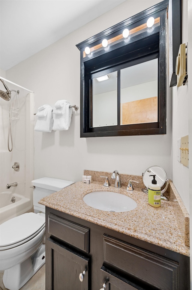 full bathroom featuring vanity, bathtub / shower combination, and toilet