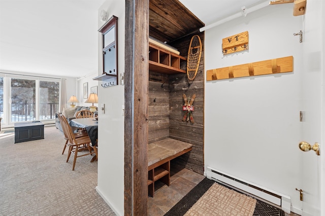 mudroom featuring carpet flooring and a baseboard heating unit