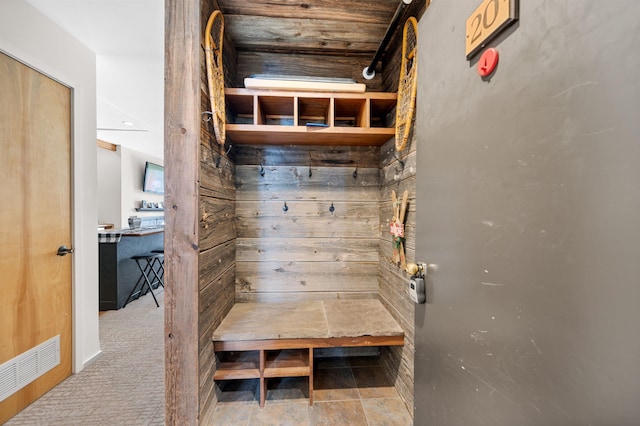 mudroom featuring light colored carpet