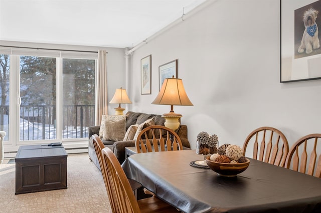 dining room featuring a baseboard heating unit