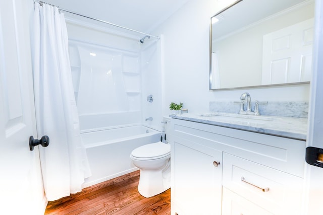 full bathroom with shower / tub combo, vanity, toilet, and wood finished floors