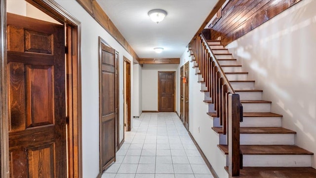 corridor featuring light tile patterned floors