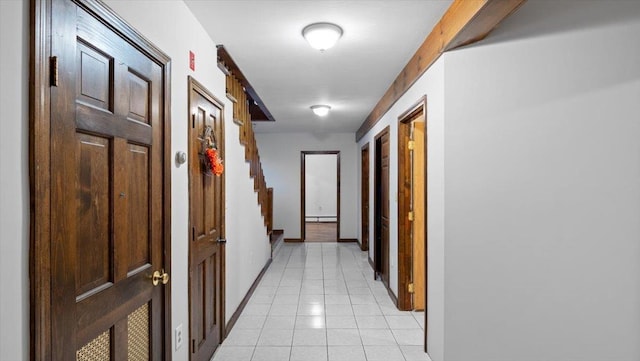 hallway featuring light tile patterned flooring