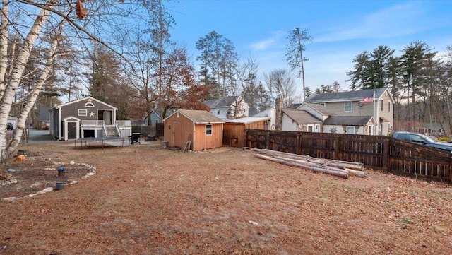 view of yard with a storage unit