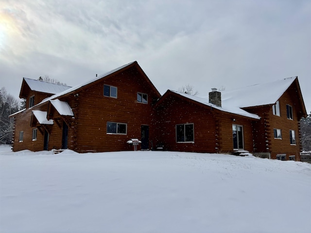 view of snow covered house