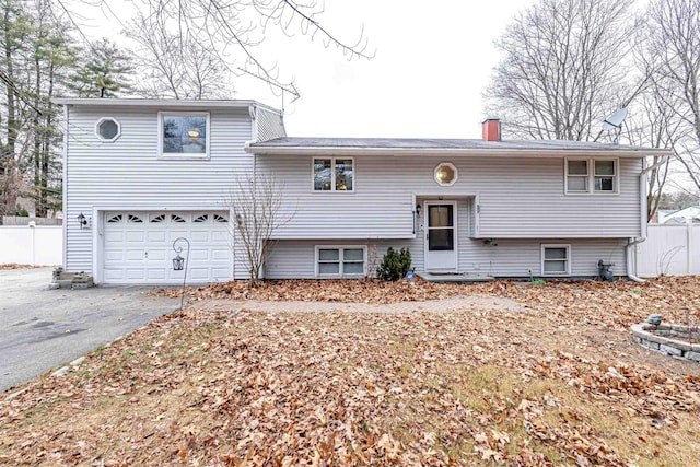 split foyer home featuring a garage