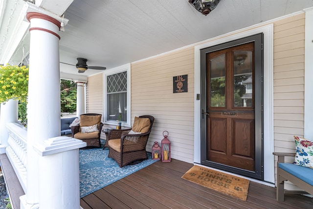 view of exterior entry featuring ceiling fan