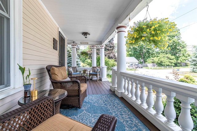 wooden terrace with a porch