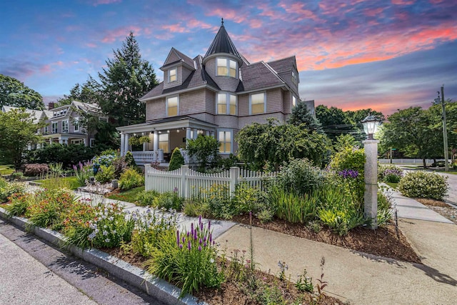 victorian house featuring a porch