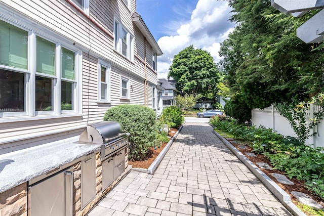 view of patio featuring a grill