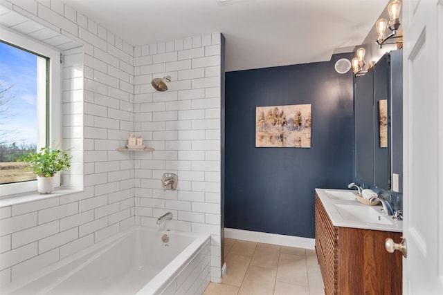 bathroom featuring tile patterned flooring, vanity, and tiled shower / bath combo