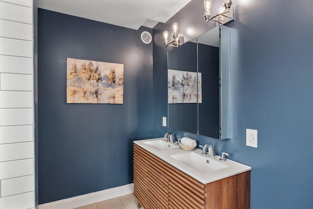 bathroom featuring tile patterned flooring and vanity