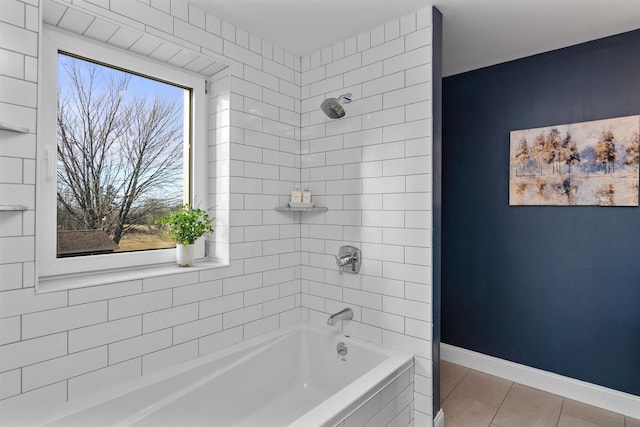 bathroom with tile patterned floors and tiled shower / bath