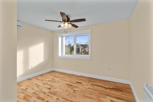 unfurnished room featuring ceiling fan and light hardwood / wood-style flooring