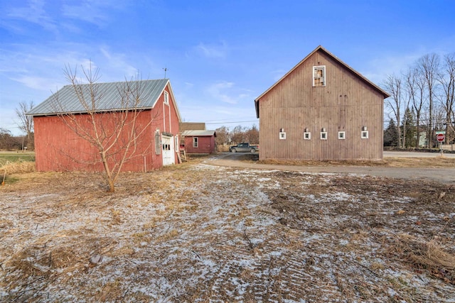 view of property exterior featuring an outdoor structure