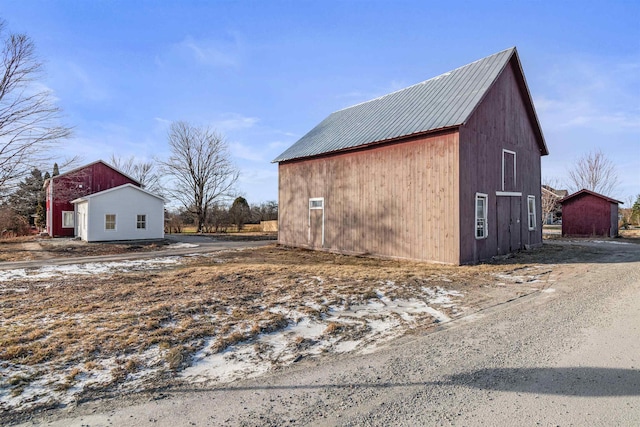 view of home's exterior featuring an outbuilding