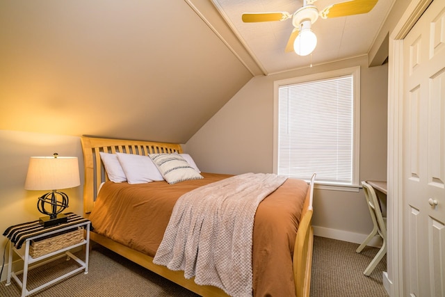 carpeted bedroom with ceiling fan and lofted ceiling