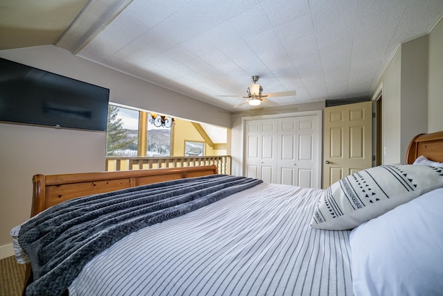 bedroom with ceiling fan and a closet