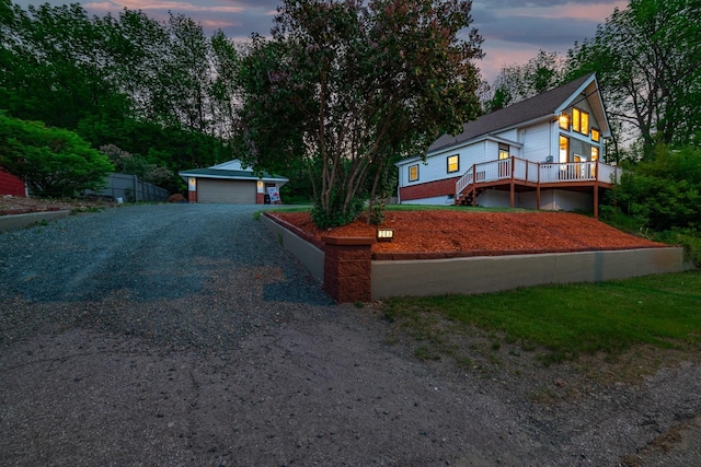 view of front of home with a garage and an outdoor structure