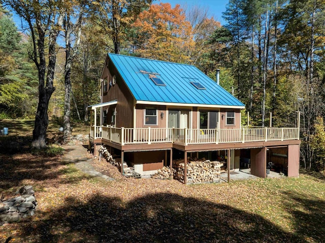 rear view of property with a deck