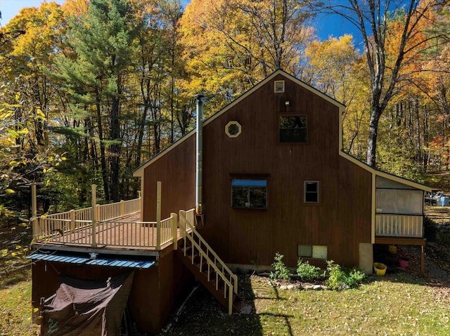 view of property exterior featuring a deck