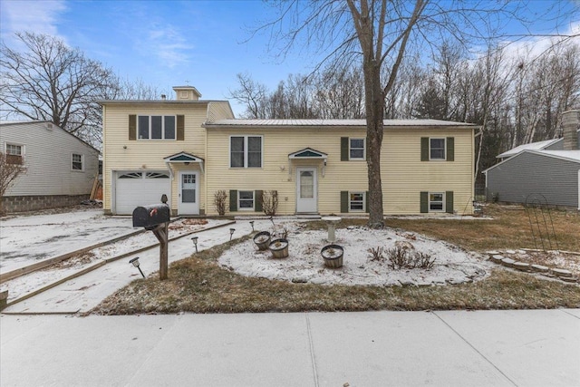 split foyer home featuring a garage