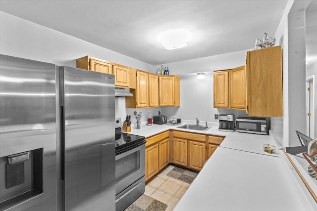 kitchen with sink, light tile patterned floors, and appliances with stainless steel finishes