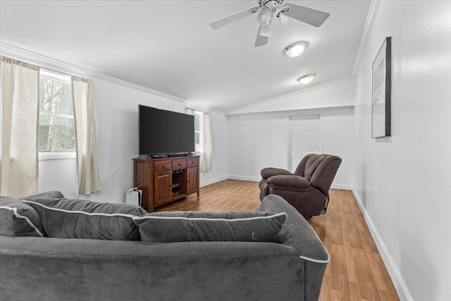 living room featuring lofted ceiling, ceiling fan, ornamental molding, and light hardwood / wood-style flooring