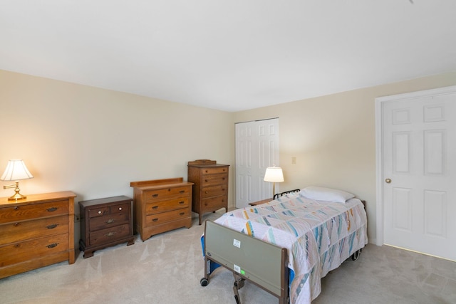 carpeted bedroom featuring a closet