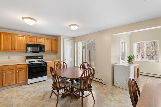 kitchen featuring a baseboard radiator and gas range gas stove