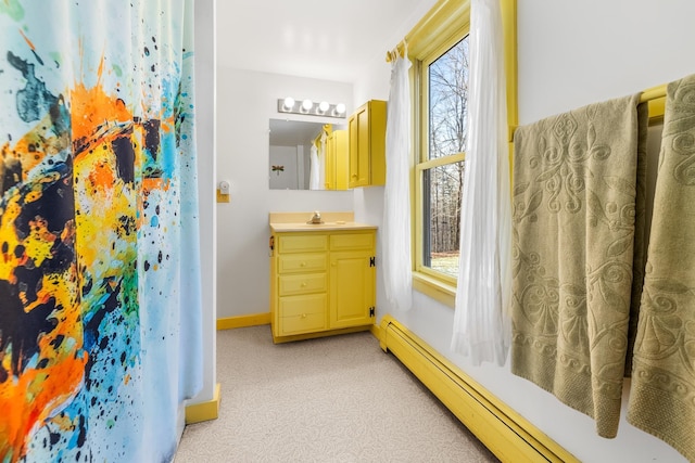 bathroom with vanity and baseboard heating